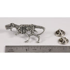 A handcrafted Tyrannosaurus Rex Fossilized Body Pin next to a ruler, available for sale at Creativeartisan.com - the image offers a sense of scale