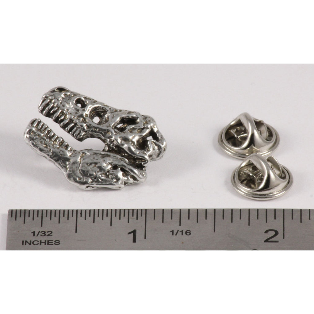 A handcrafted Tyrannosaurus Rex Fossilized Head Pin next to a ruler, available for sale at Creativeartisan.com - the image offers a sense of scale