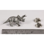 A handcrafted Triceratops Pin next to a ruler, available for sale at Creativeartisan.com - the image offers a sense of scale
