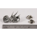 A handcrafted Triceratops Fossilized Head Pin next to a ruler, available for sale at Creativeartisan.com - the image offers a sense of scale