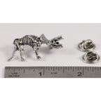 A handcrafted Triceratops Fossilized Full Body Pin next to a ruler, available for sale at Creativeartisan.com - the image offers a sense of scale