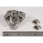 A handcrafted Saber Toothed Cat Skull Pin next to a ruler, available for sale at Creativeartisan.com - the image offers a sense of scale