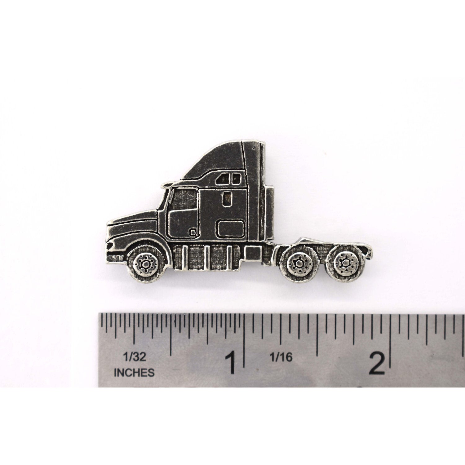 A handcrafted Semi Truck Long Nose Pin next to a ruler, available for sale at Creativeartisan.com - the image offers a sense of scale