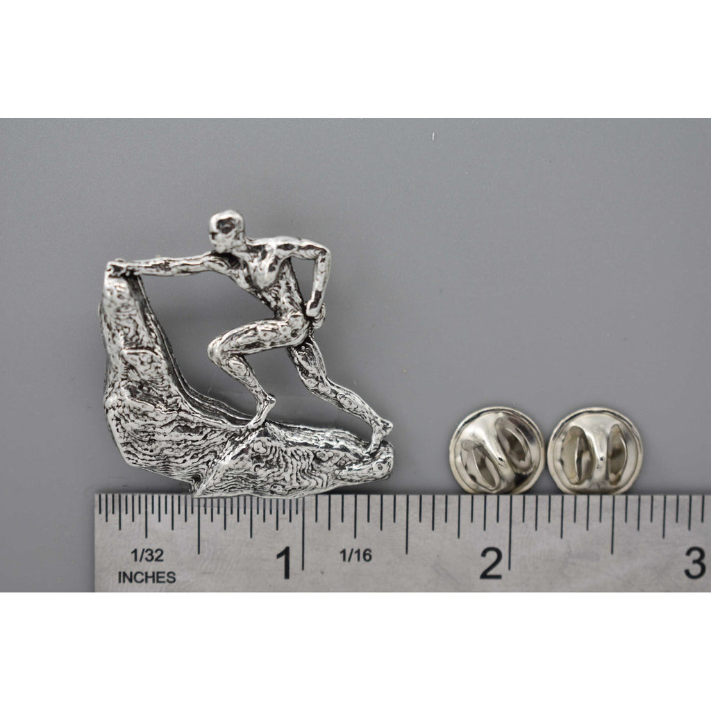 A handcrafted Rock Climber Male Pin next to a ruler, available for sale at Creativeartisan.com - the image offers a sense of scale