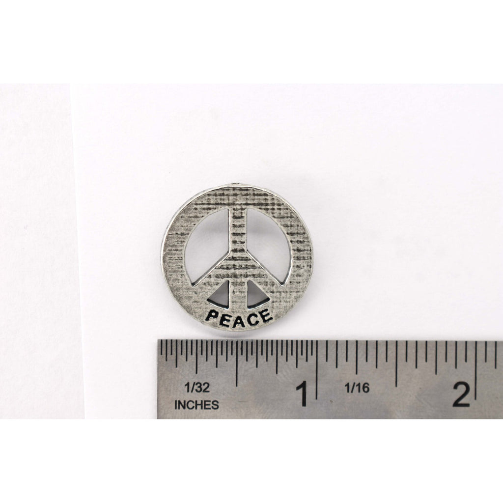 A handcrafted Peace Imprinted With Peace Pin next to a ruler, available for sale at Creativeartisan.com - the image offers a sense of scale