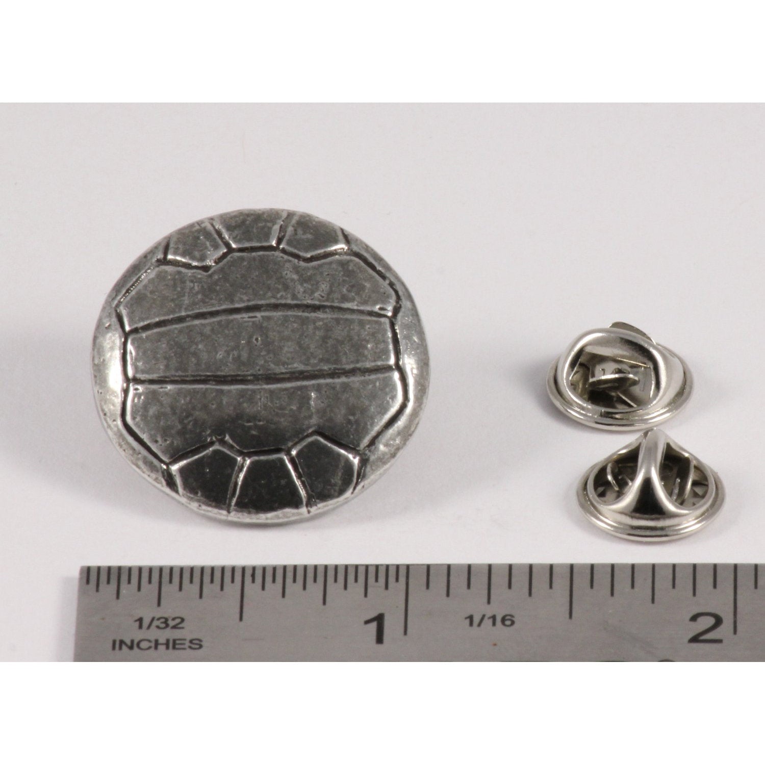 A handcrafted Soccer Ball W Lines Pin next to a ruler, available for sale at Creativeartisan.com - the image offers a sense of scale