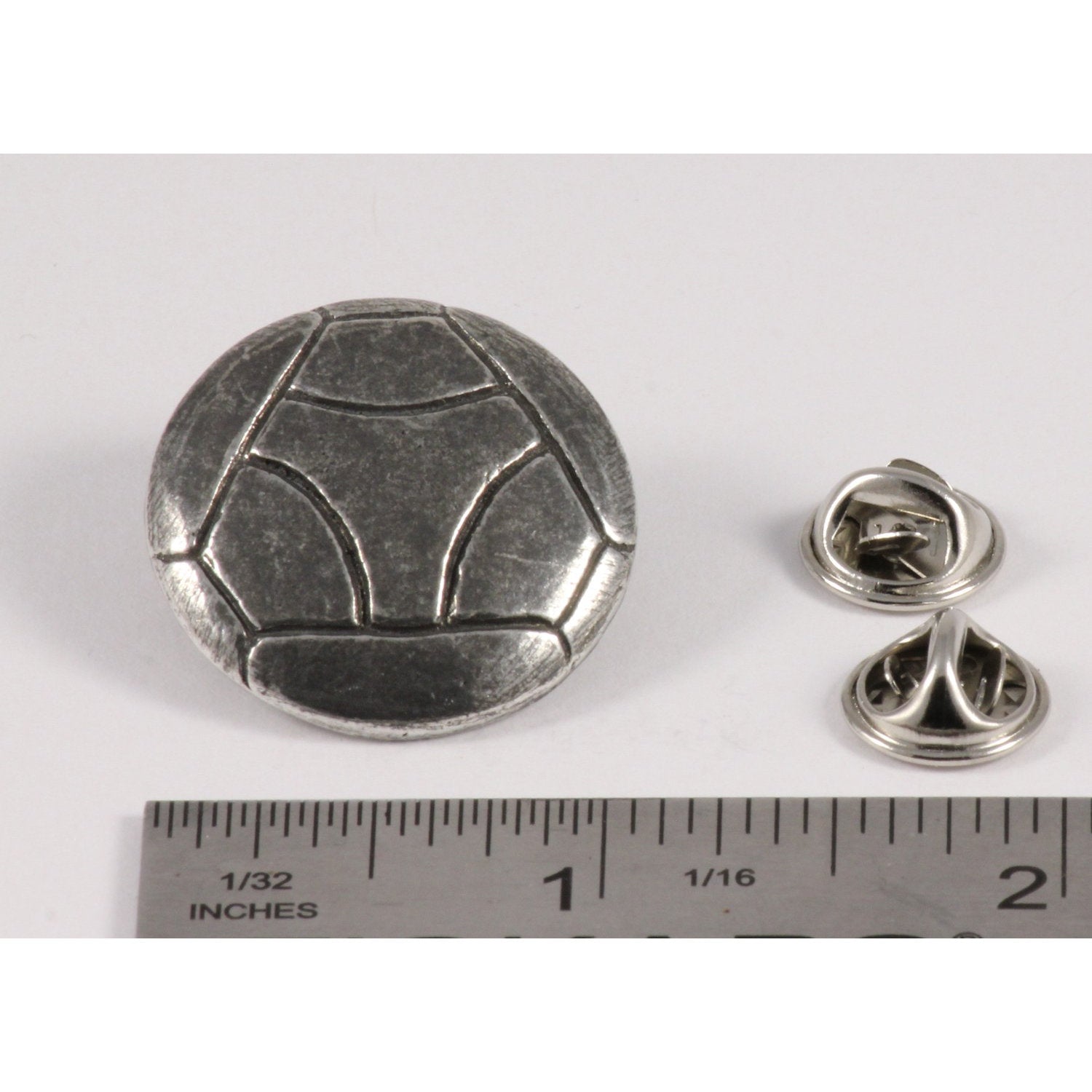 A handcrafted Soccer Ball W Y Pin next to a ruler, available for sale at Creativeartisan.com - the image offers a sense of scale