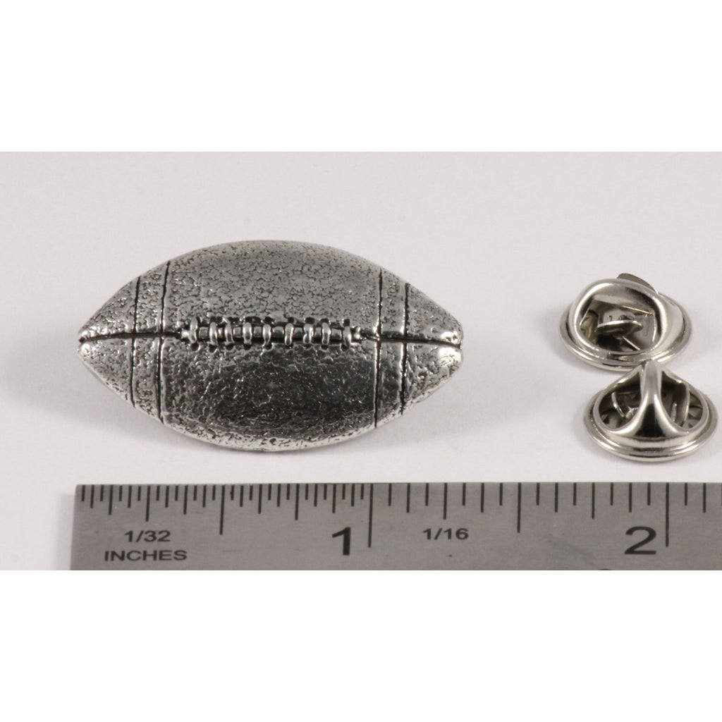A handcrafted Football Pin next to a ruler, available for sale at Creativeartisan.com - the image offers a sense of scale