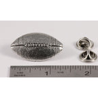A handcrafted Football Pin next to a ruler, available for sale at Creativeartisan.com - the image offers a sense of scale