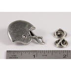 A handcrafted Football Helmet Pin next to a ruler, available for sale at Creativeartisan.com - the image offers a sense of scale