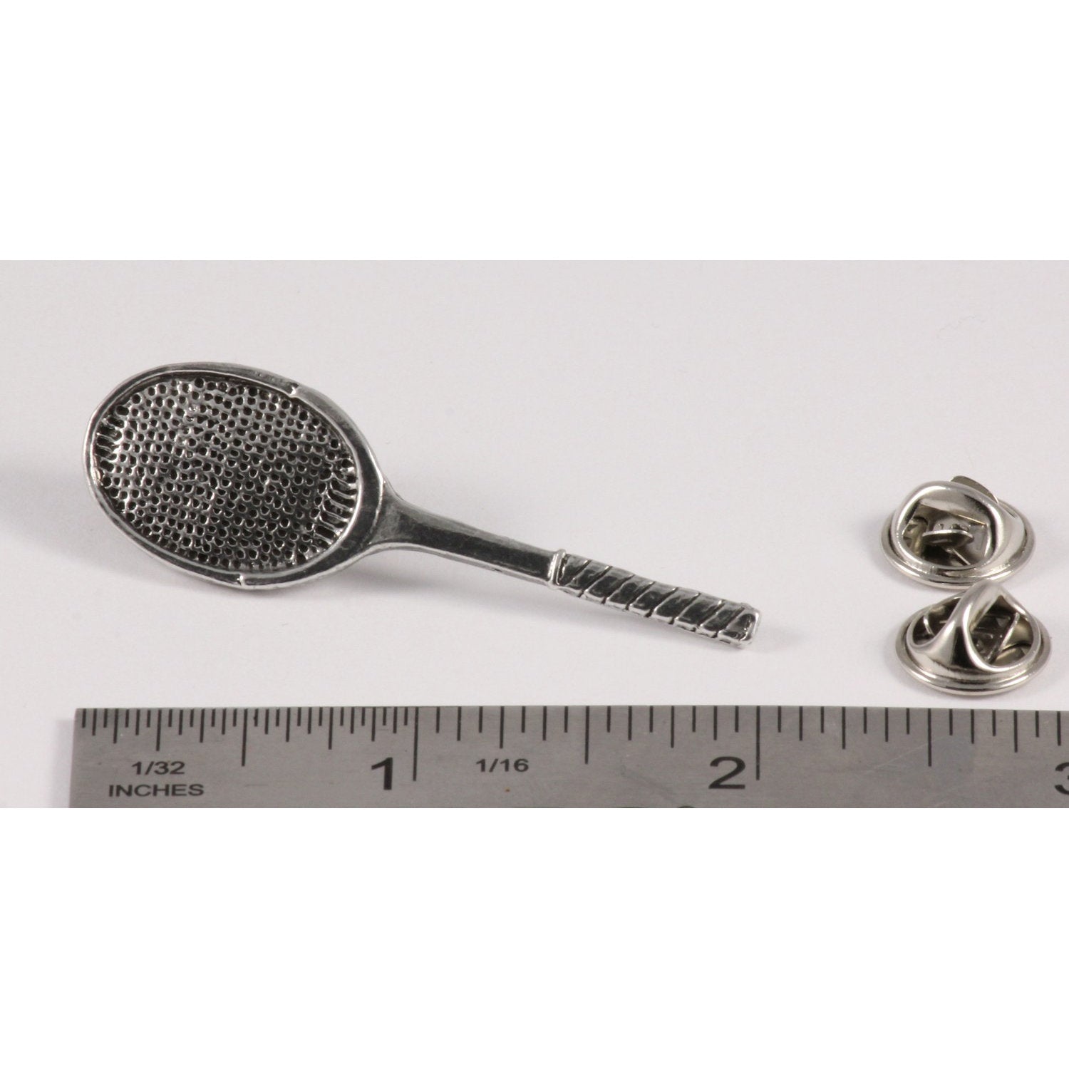 A handcrafted Tennis Racquet Pin next to a ruler, available for sale at Creativeartisan.com - the image offers a sense of scale