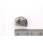 A handcrafted La Crosse Helmet Pin next to a ruler, available for sale at Creativeartisan.com - the image offers a sense of scale