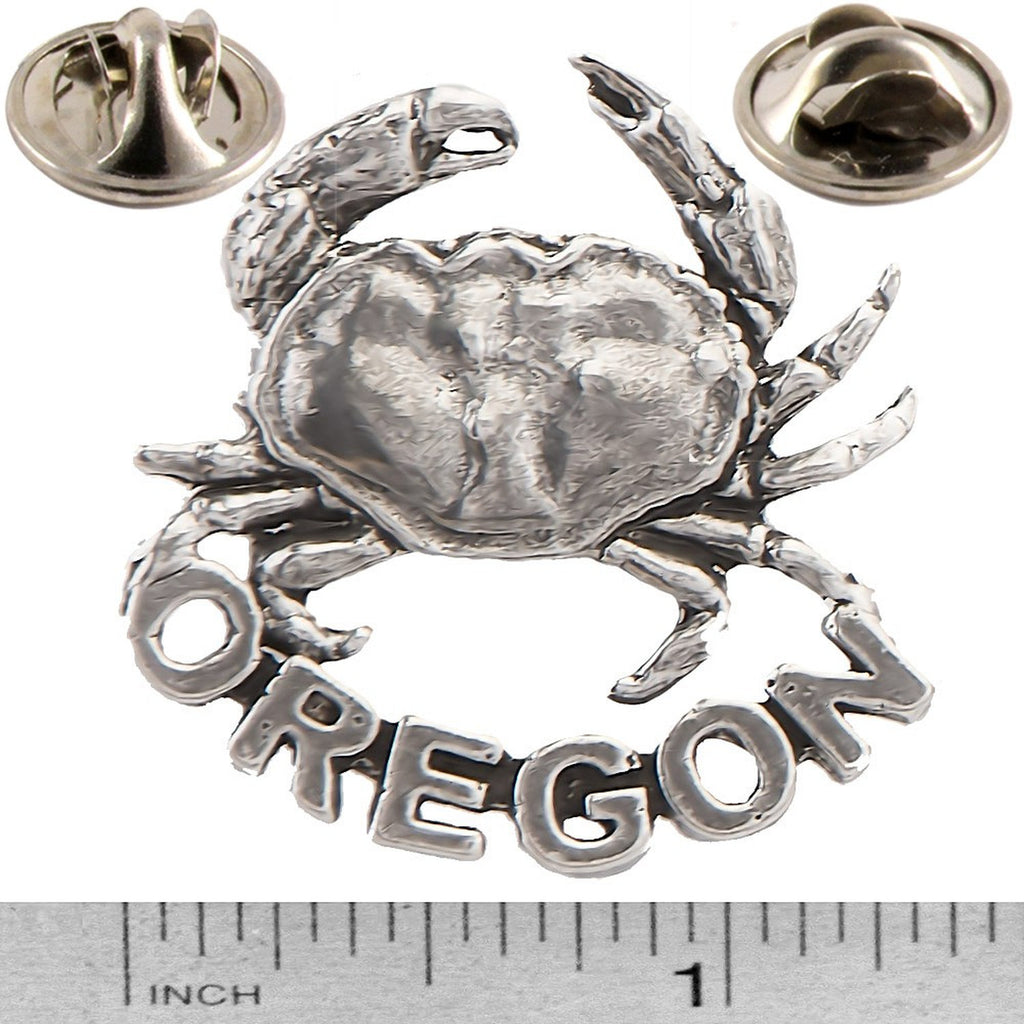 A handcrafted Dungeness Crab Oregon Pin next to a ruler, available for sale at Creativeartisan.com - the image offers a sense of scale