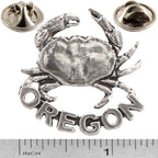 A handcrafted Dungeness Crab Oregon Pin next to a ruler, available for sale at Creativeartisan.com - the image offers a sense of scale