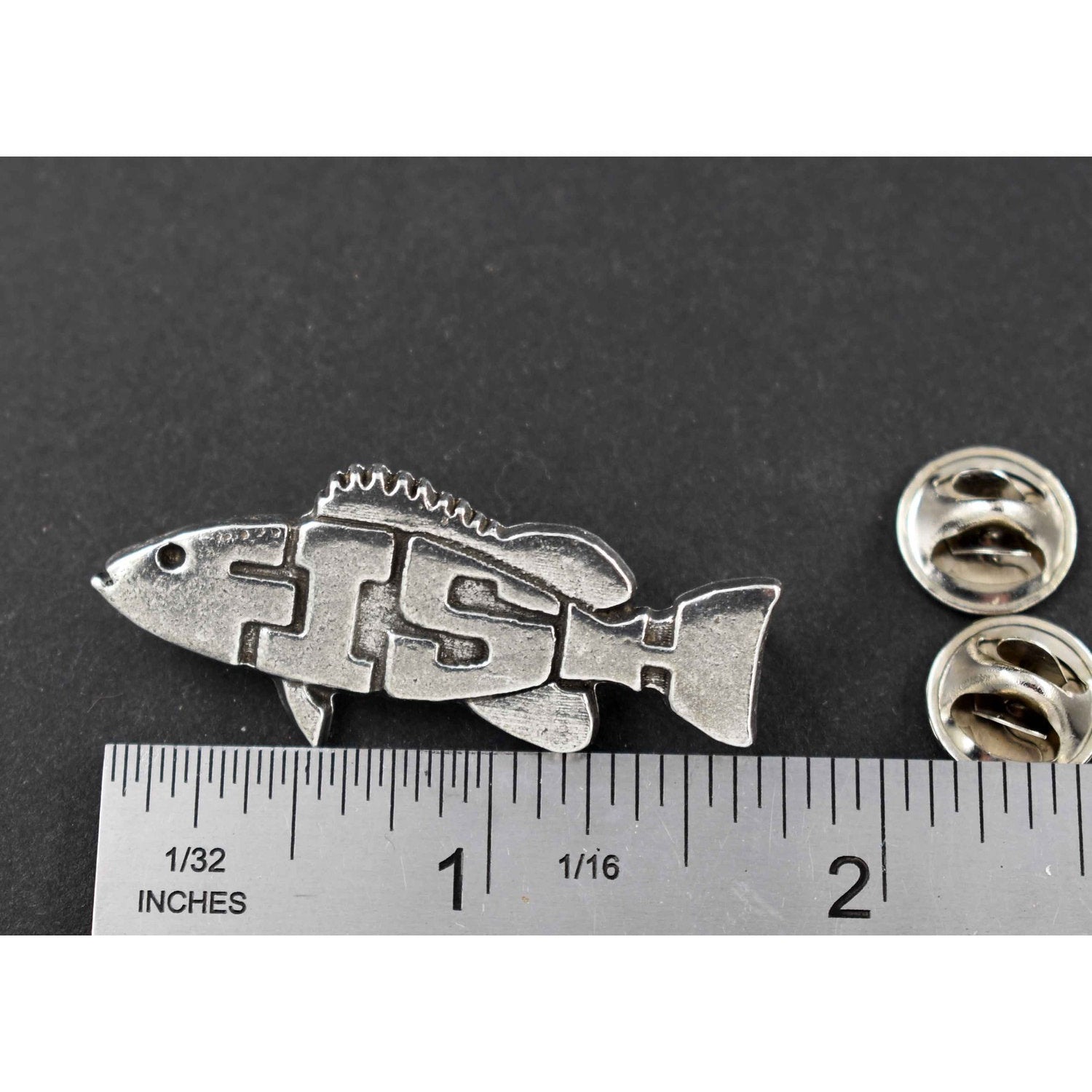 A handcrafted Angel Fish Pin Spelled Out next to a ruler, available for sale at Creativeartisan.com - the image offers a sense of scale