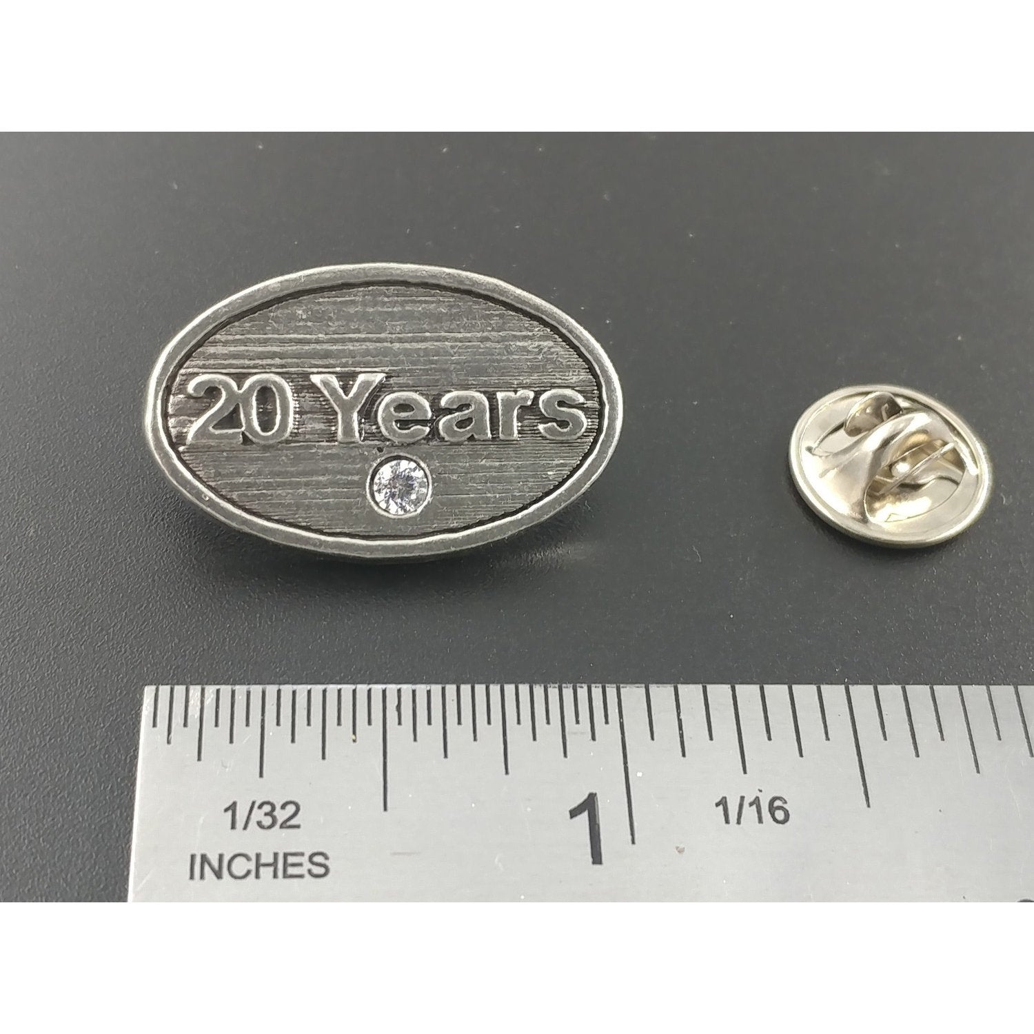 A handcrafted 20 Year Pin next to a ruler, available for sale at Creativeartisan.com - the image offers a sense of scale