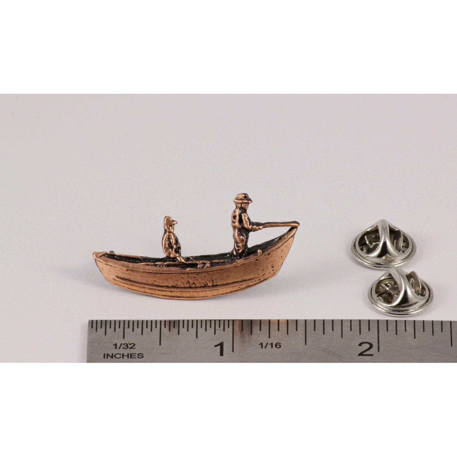 A handcrafted Drift Boat Pin next to a ruler, available for sale at Creativeartisan.com - the image offers a sense of scale
