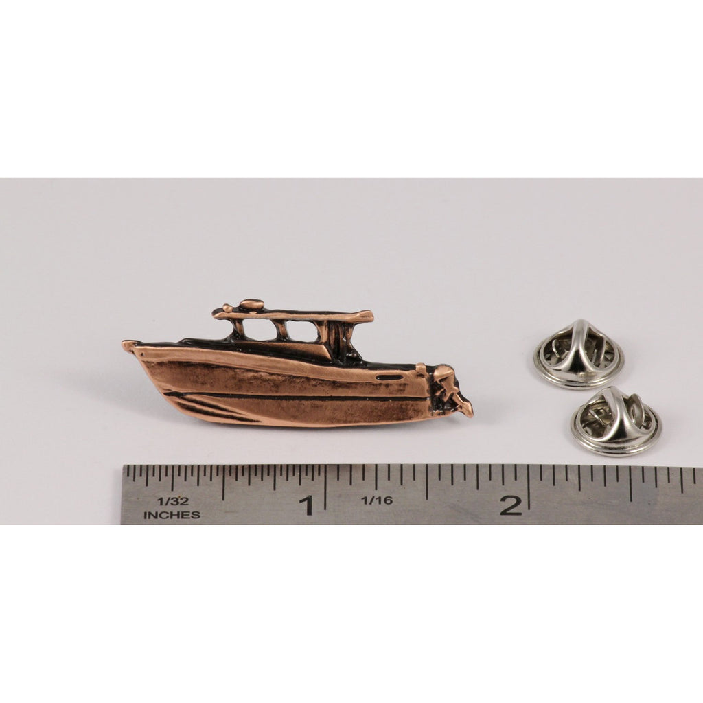 A handcrafted Power Boat Pin next to a ruler, available for sale at Creativeartisan.com - the image offers a sense of scale