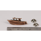 A handcrafted Power Boat Pin next to a ruler, available for sale at Creativeartisan.com - the image offers a sense of scale