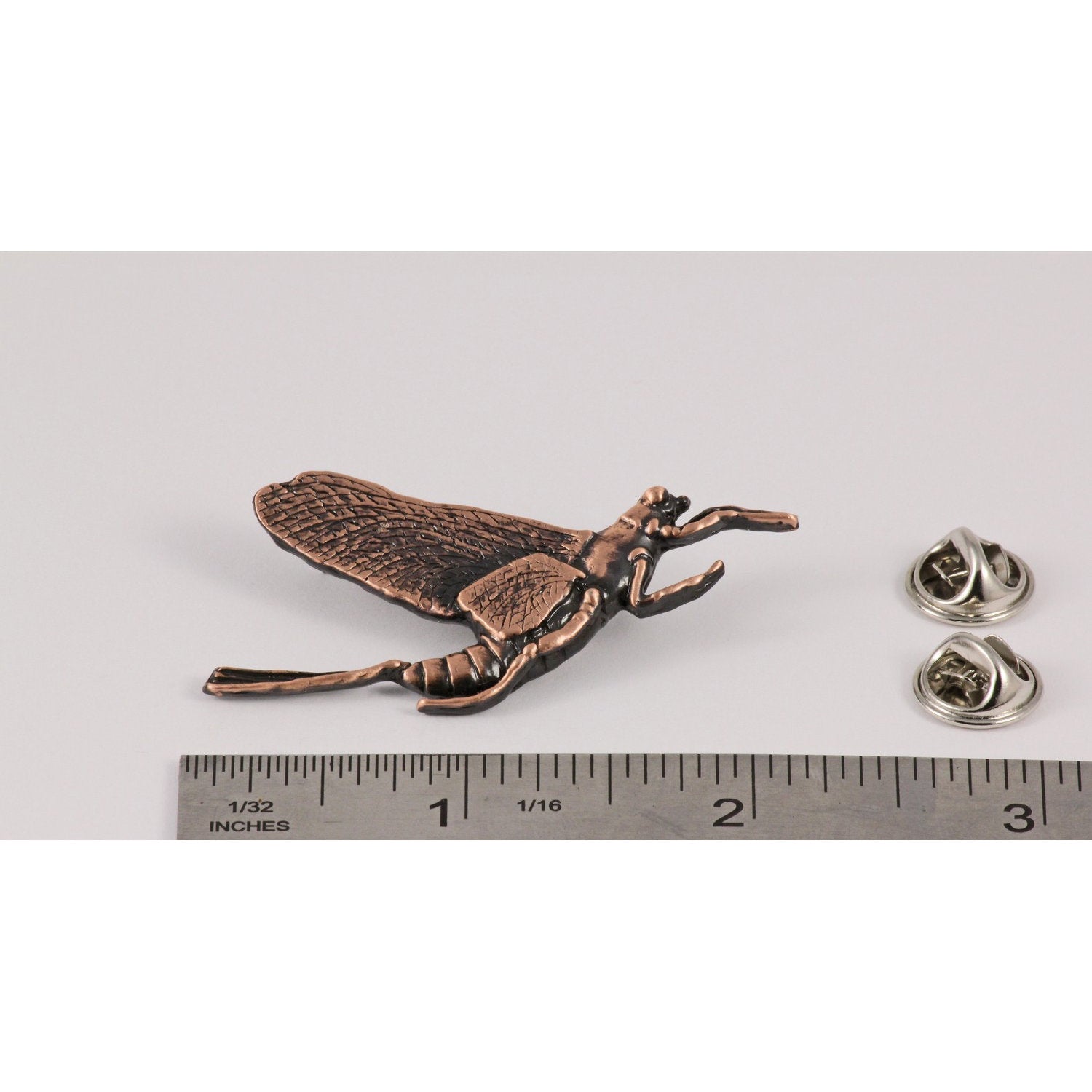 A handcrafted Mayfly Pin next to a ruler, available for sale at Creativeartisan.com - the image offers a sense of scale