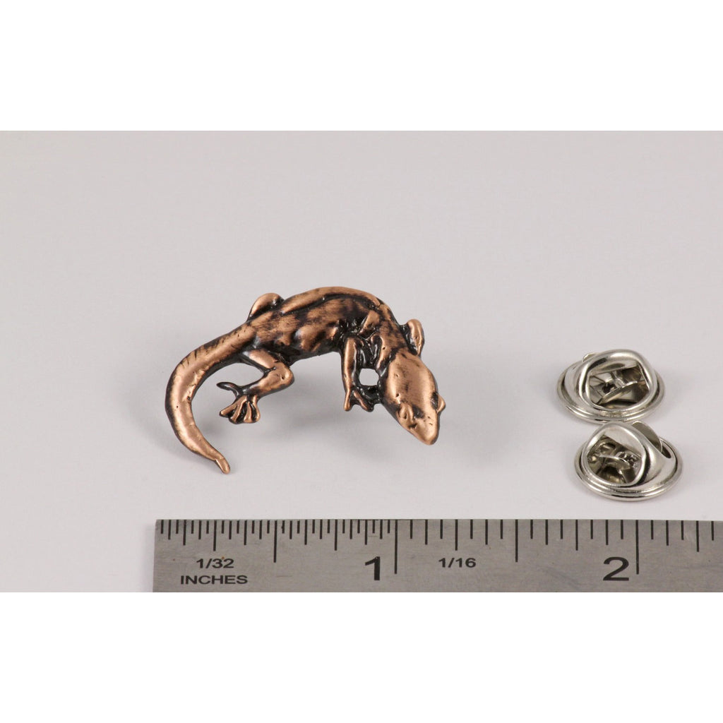 A handcrafted Gecko Pin next to a ruler, available for sale at Creativeartisan.com - the image offers a sense of scale