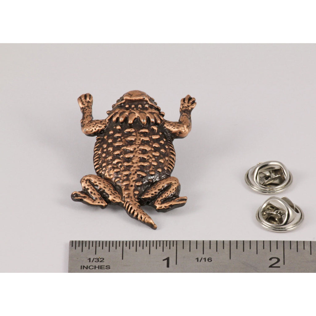 A handcrafted Horny Toad Short Horned Lizard Pin next to a ruler, available for sale at Creativeartisan.com - the image offers a sense of scale