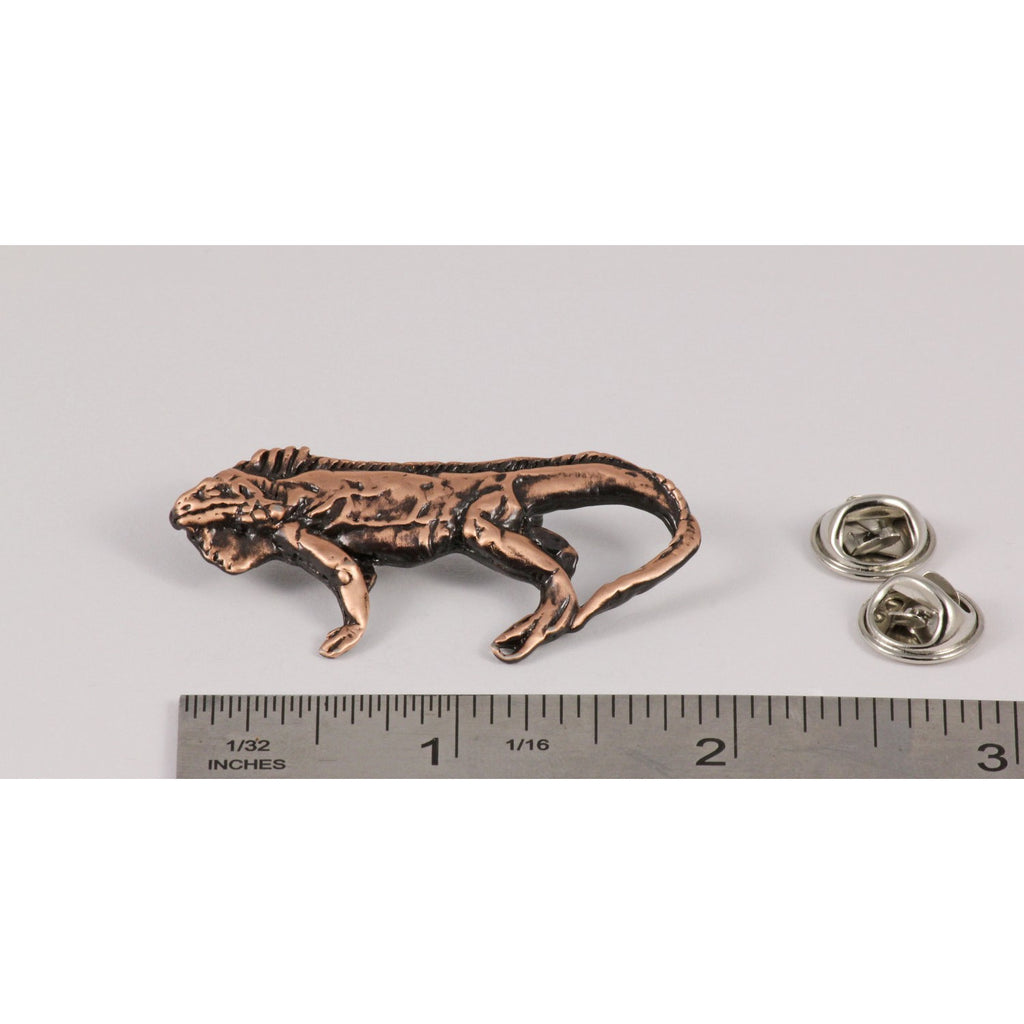 A handcrafted Iguana Pin next to a ruler, available for sale at Creativeartisan.com - the image offers a sense of scale