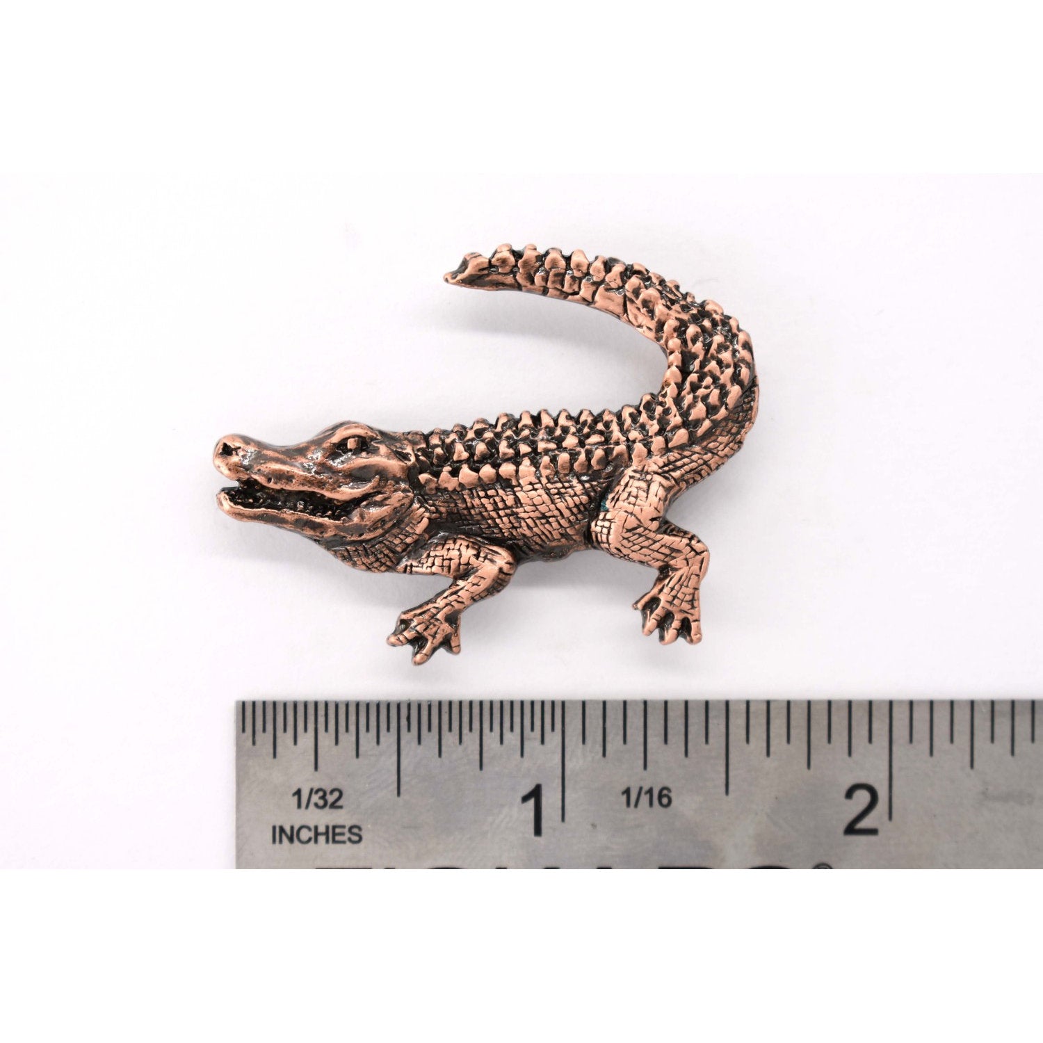 A handcrafted Alligator Crocodile Pin next to a ruler, available for sale at Creativeartisan.com - the image offers a sense of scale