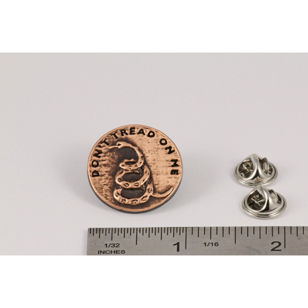 A handcrafted Dont Tread On Me Pin next to a ruler, available for sale at Creativeartisan.com - the image offers a sense of scale