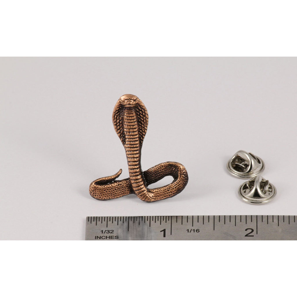 A handcrafted Cobra Pin next to a ruler, available for sale at Creativeartisan.com - the image offers a sense of scale