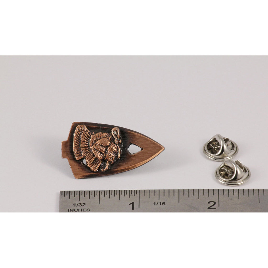 A handcrafted Broadhead With Turkey Pin next to a ruler, available for sale at Creativeartisan.com - the image offers a sense of scale