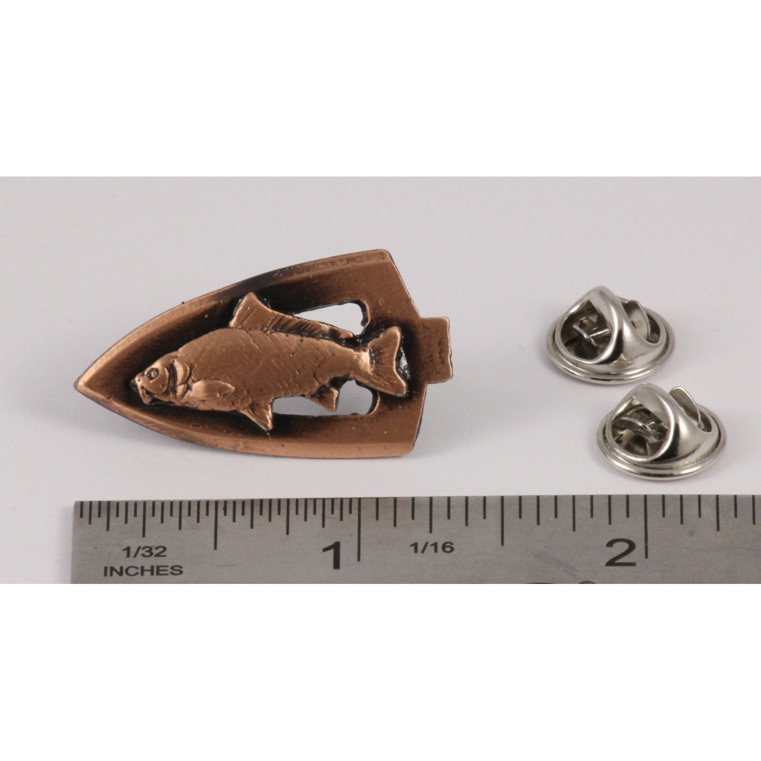 A handcrafted Broadhead With Carp Pin next to a ruler, available for sale at Creativeartisan.com - the image offers a sense of scale