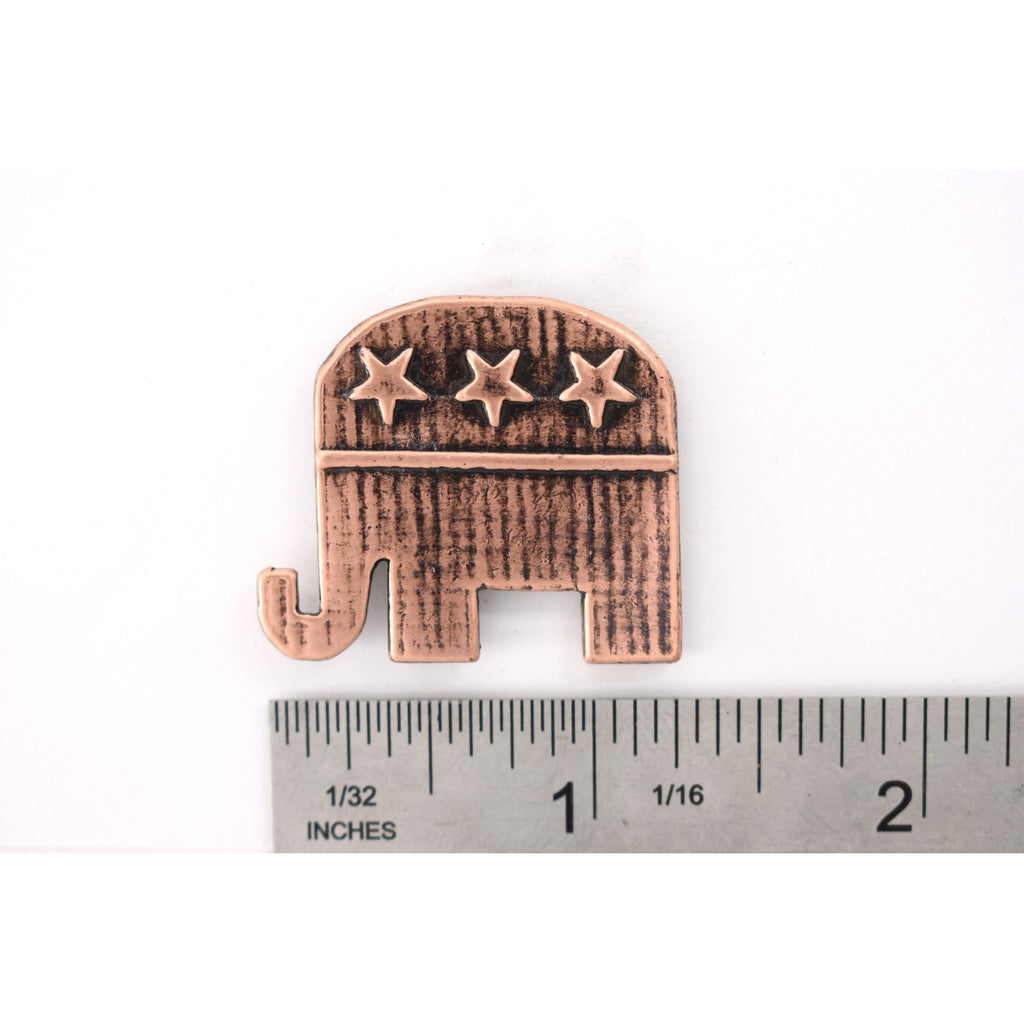 A handcrafted Republic Elephant Pin next to a ruler, available for sale at Creativeartisan.com - the image offers a sense of scale