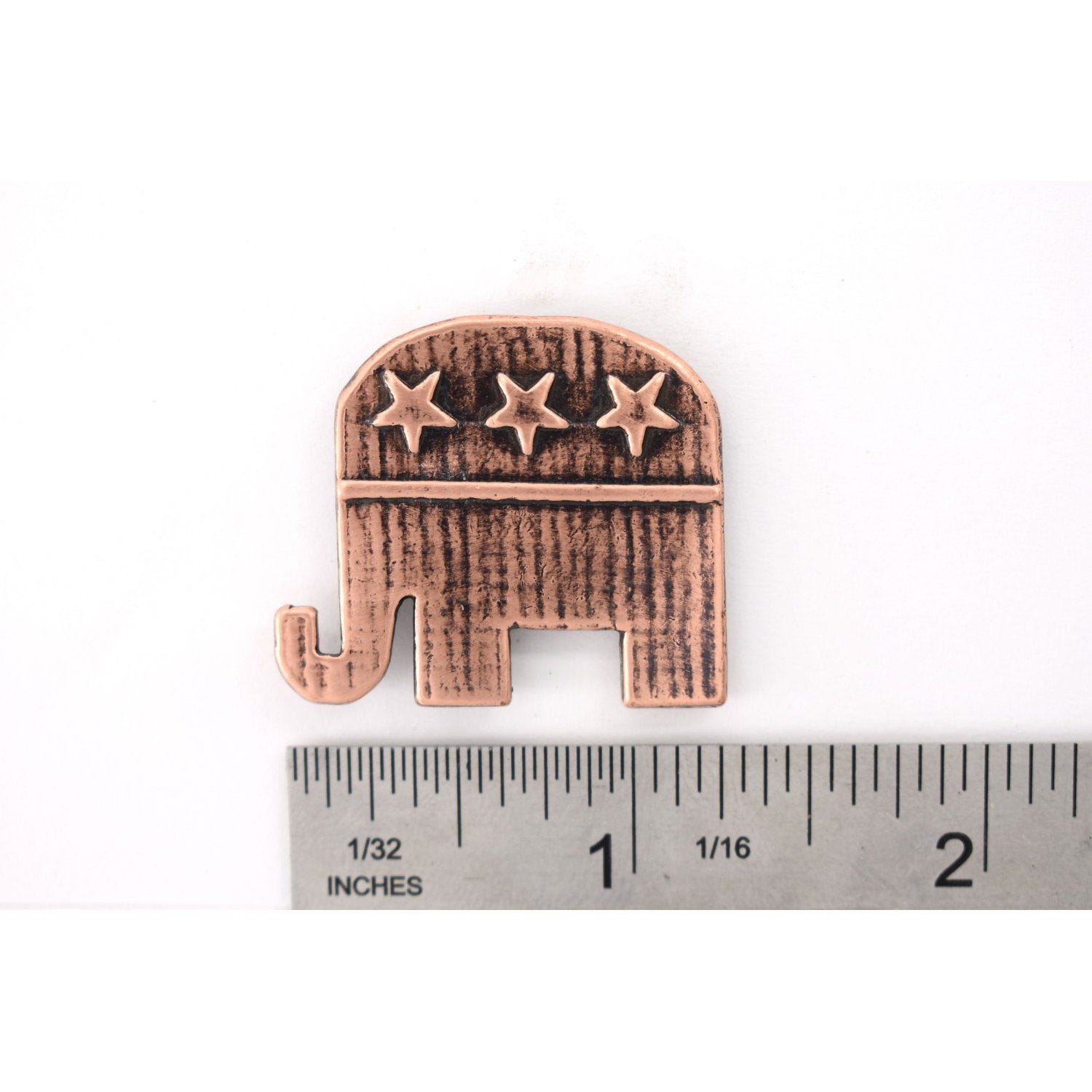 A handcrafted Republic Elephant Pin next to a ruler, available for sale at Creativeartisan.com - the image offers a sense of scale