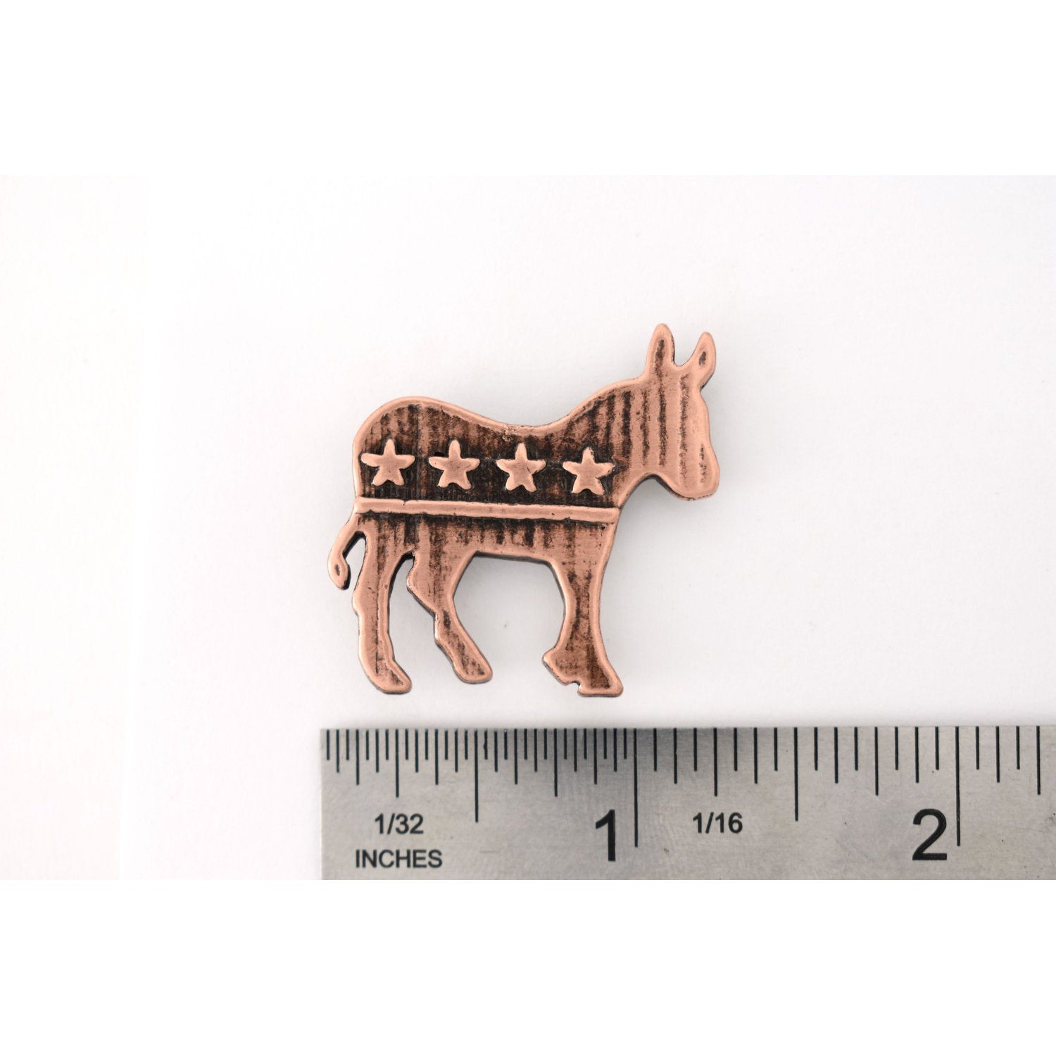 A handcrafted Democrat Monkey Pin next to a ruler, available for sale at Creativeartisan.com - the image offers a sense of scale