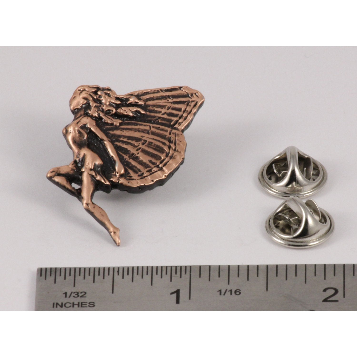 A handcrafted Fairy Pin next to a ruler, available for sale at Creativeartisan.com - the image offers a sense of scale