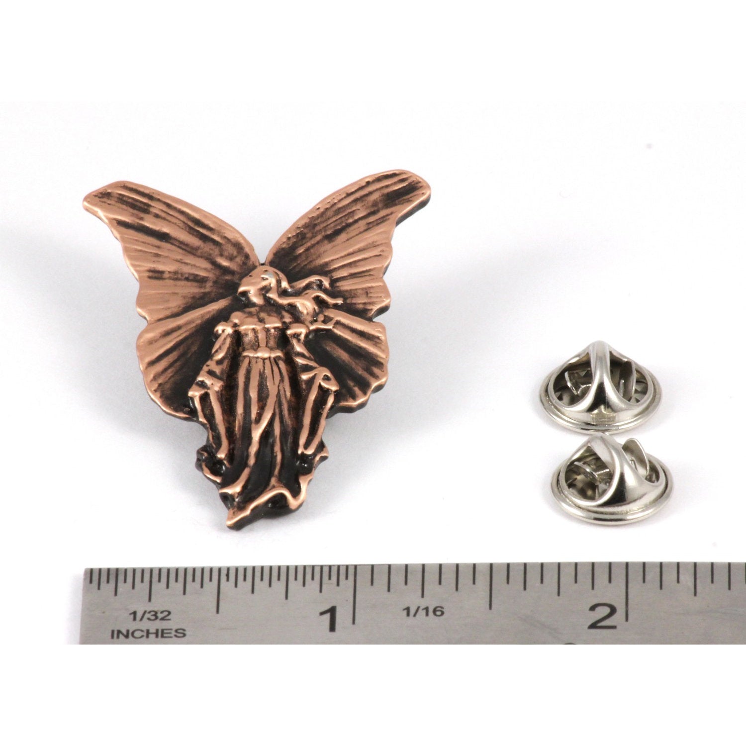 A handcrafted Angel Pin next to a ruler, available for sale at Creativeartisan.com - the image offers a sense of scale