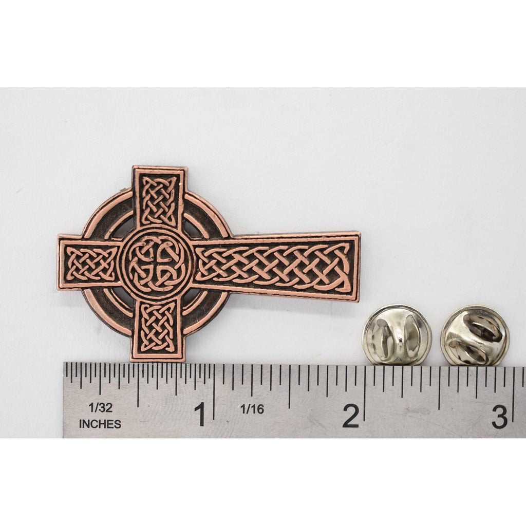 A handcrafted Celtic Cross New Pin next to a ruler, available for sale at Creativeartisan.com - the image offers a sense of scale
