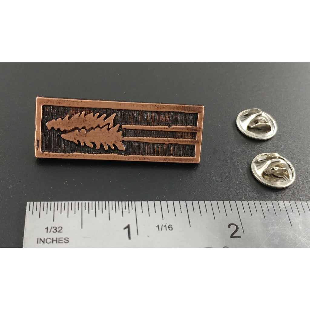 A handcrafted Tall Trees Pin next to a ruler, available for sale at Creativeartisan.com - the image offers a sense of scale