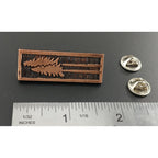 A handcrafted Tall Trees Pin next to a ruler, available for sale at Creativeartisan.com - the image offers a sense of scale