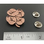 A handcrafted Four Leaf Clover Pin next to a ruler, available for sale at Creativeartisan.com - the image offers a sense of scale