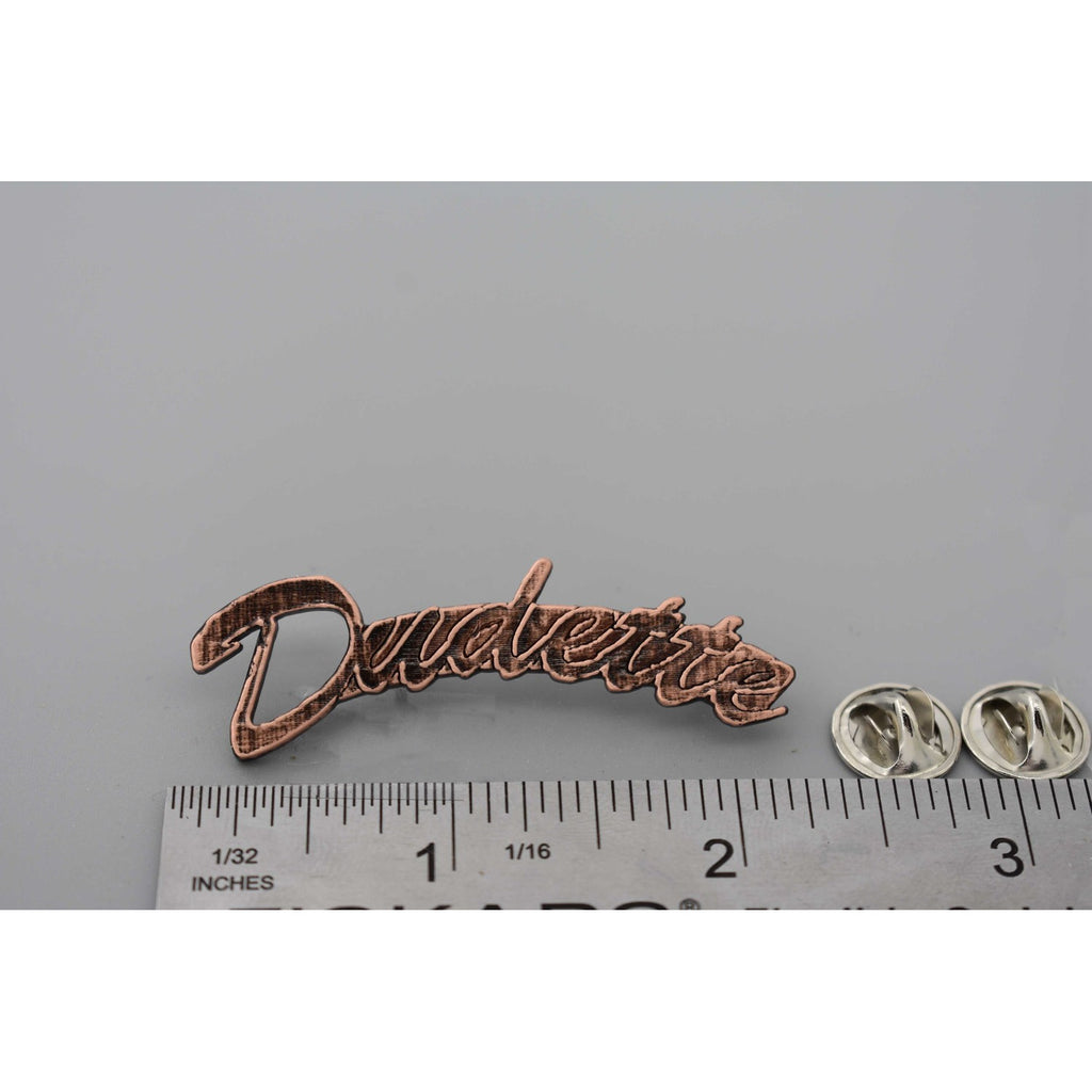 A handcrafted Dudette Pin next to a ruler, available for sale at Creativeartisan.com - the image offers a sense of scale