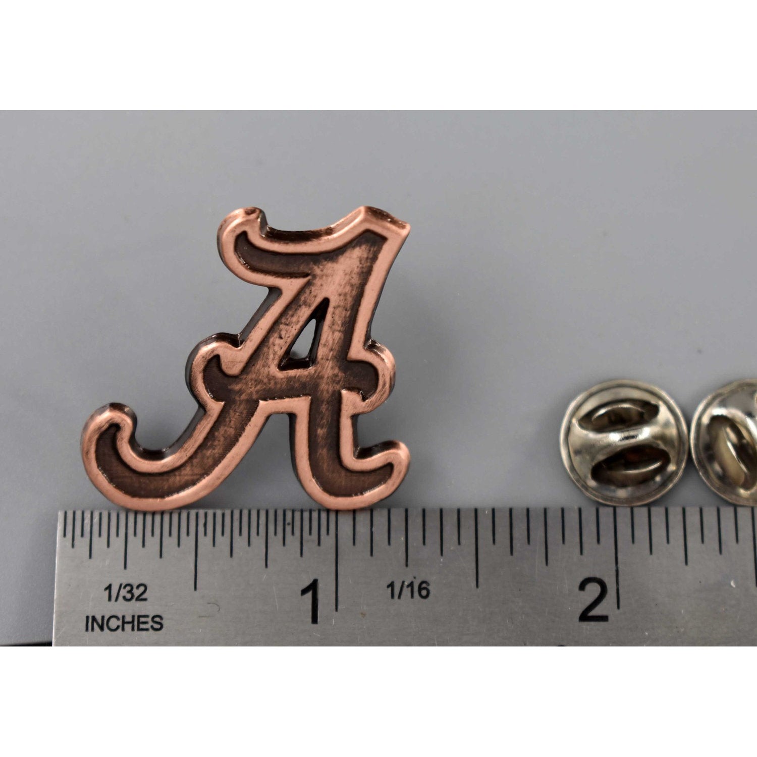 A handcrafted Fancy A Pin next to a ruler, available for sale at Creativeartisan.com - the image offers a sense of scale