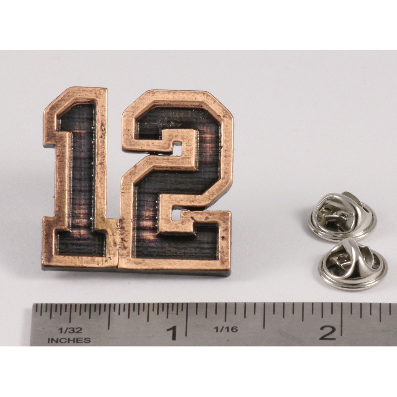 A handcrafted 12 Pin next to a ruler, available for sale at Creativeartisan.com - the image offers a sense of scale