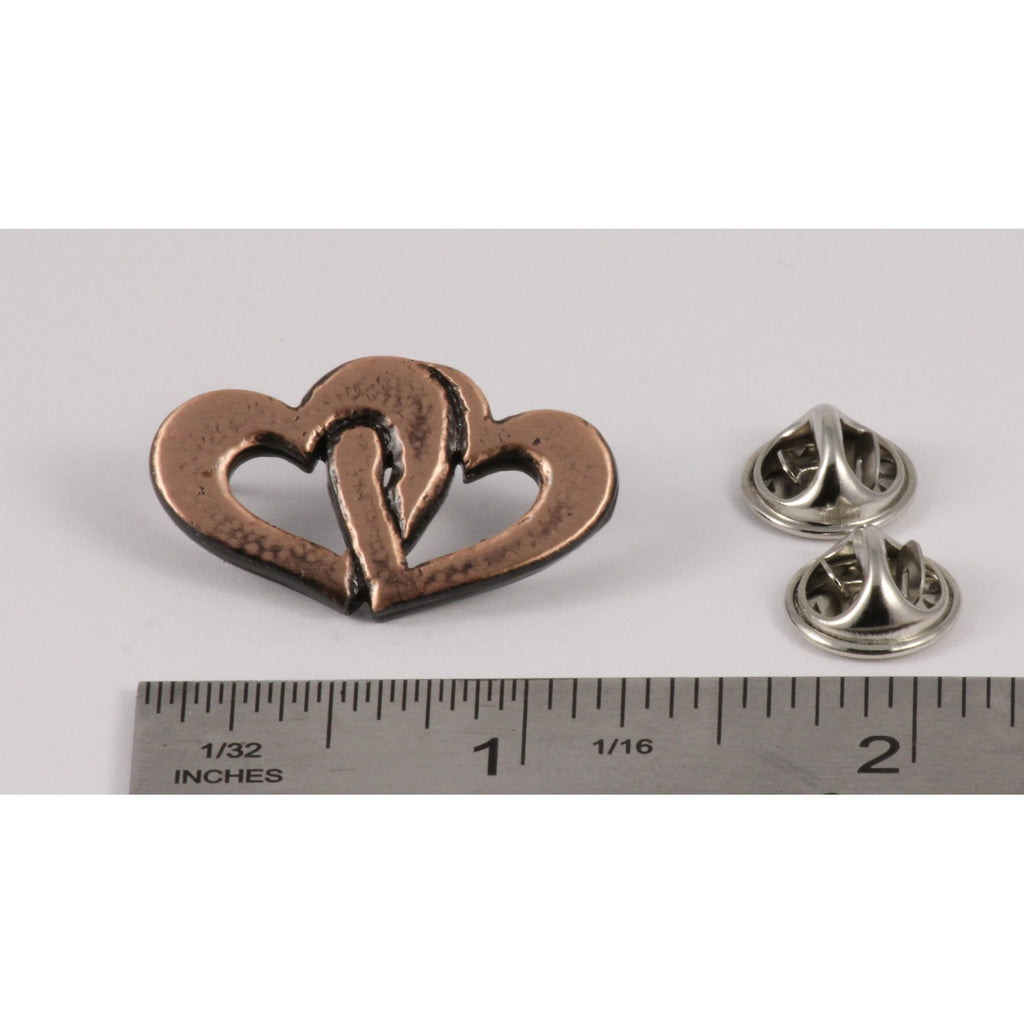 A handcrafted Double Heart Pin next to a ruler, available for sale at Creativeartisan.com - the image offers a sense of scale