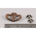 A handcrafted Double Heart Pin next to a ruler, available for sale at Creativeartisan.com - the image offers a sense of scale