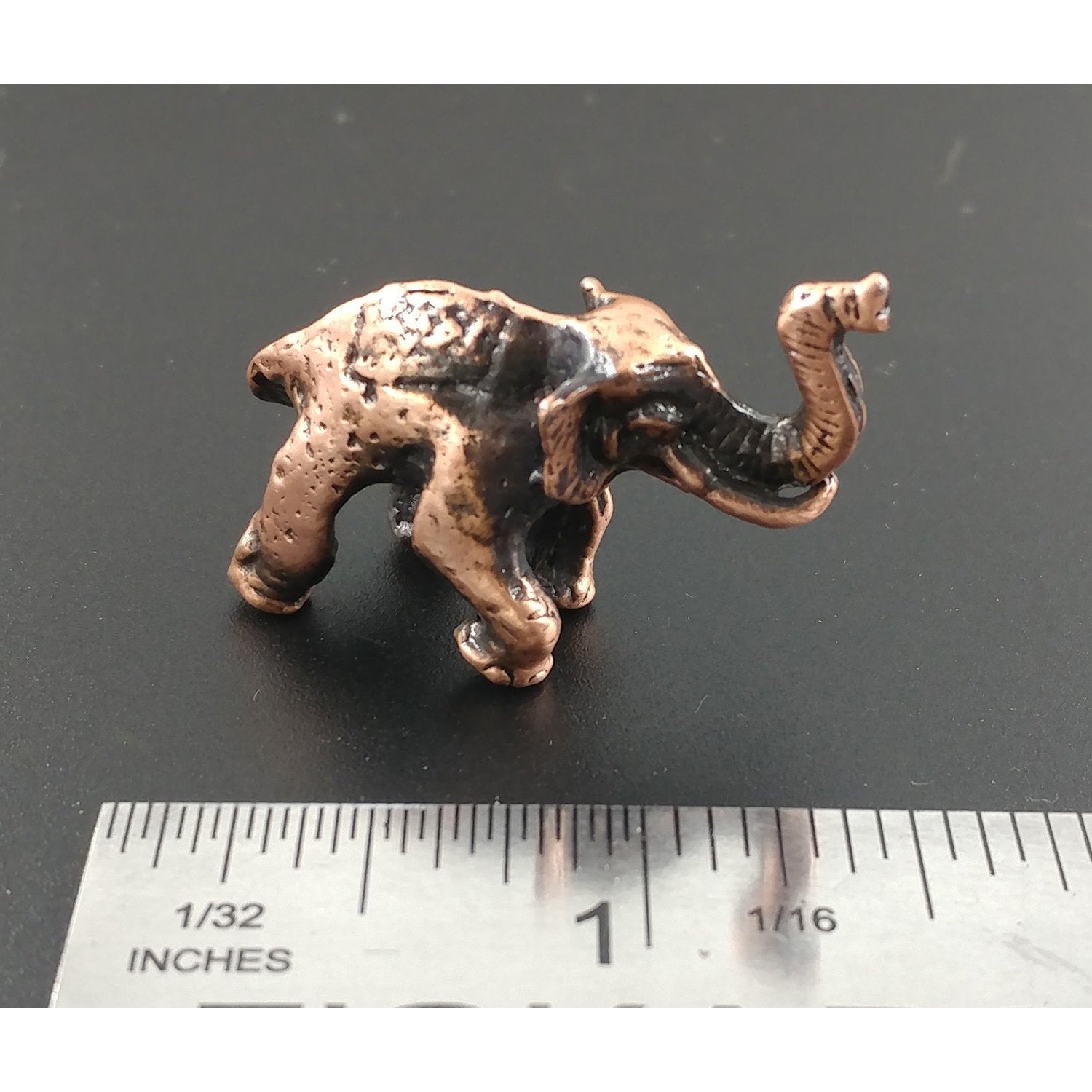 A handcrafted Elephant 3D Pin next to a ruler, available for sale at Creativeartisan.com - the image offers a sense of scale