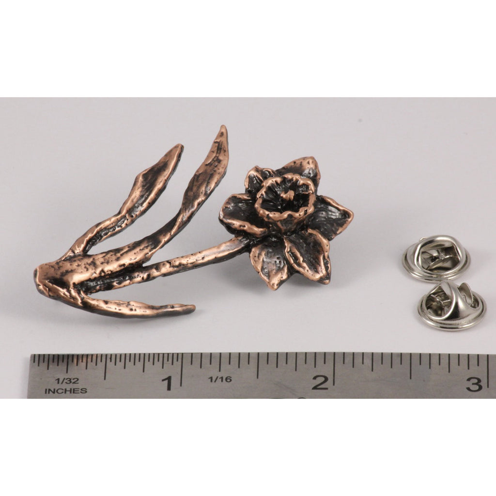 A handcrafted Daffodil Pin next to a ruler, available for sale at Creativeartisan.com - the image offers a sense of scale