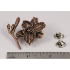 A handcrafted Day Lilly Pin next to a ruler, available for sale at Creativeartisan.com - the image offers a sense of scale