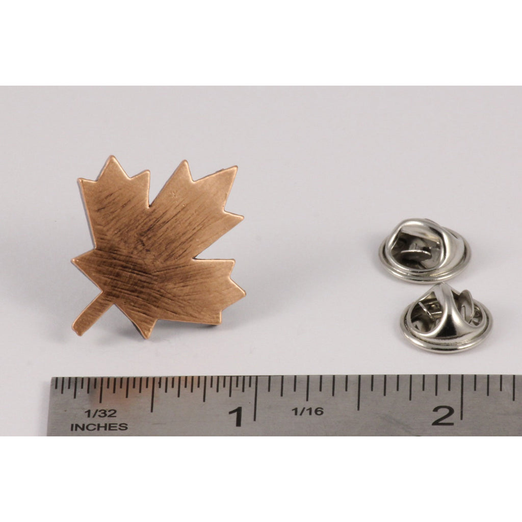 A handcrafted Canadian Maple Leaf Pin next to a ruler, available for sale at Creativeartisan.com - the image offers a sense of scale